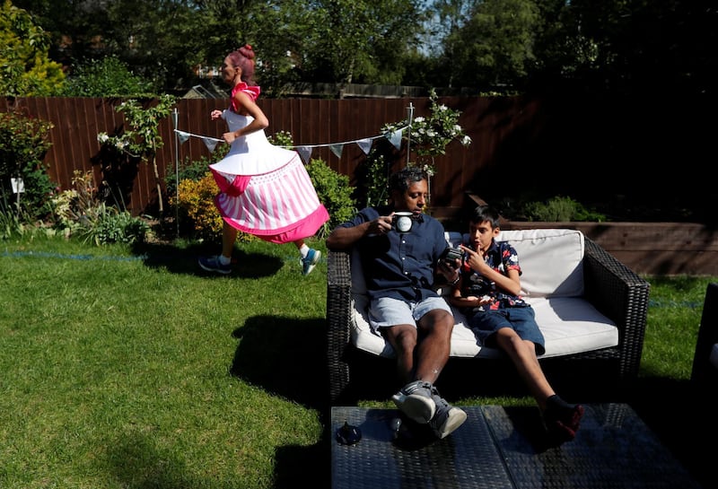 Anna Bassil runs a marathon distance dressed as a cake around her garden in St Albans. The London Marathon was due to take place today but was postponed following the outbreak of the coronavirus disease (COVID-19), St Albans, Britain. REUTERS