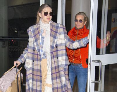 NEW YORK, NY - MARCH 03: Gigi Hadid with her mother Yolanda Hadid arrive at JFK Airport on March 3, 2020 in New York City. (Photo by Adrian Edwards/GC Images)