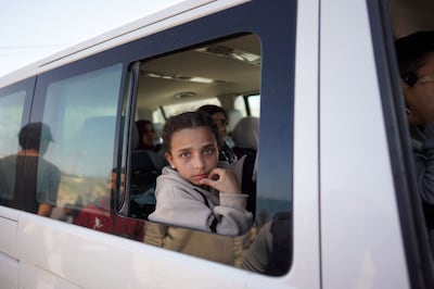 People who fled the Al Shifa Hospital and its vicinity in Gaza City are driven from the central Gaza Strip further south, on March 21, 2024.  AFP