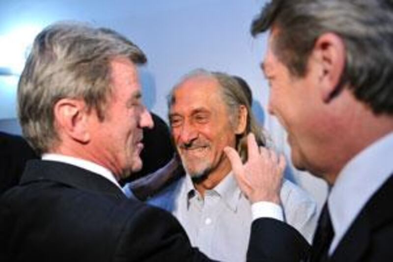The French hostage Pierre Camatte, centre, was greeted by the French foreign and European affairs minister, Bernard Kouchner, left, and the French junior minister for foreign aid and Francophony Alain Joyandet.