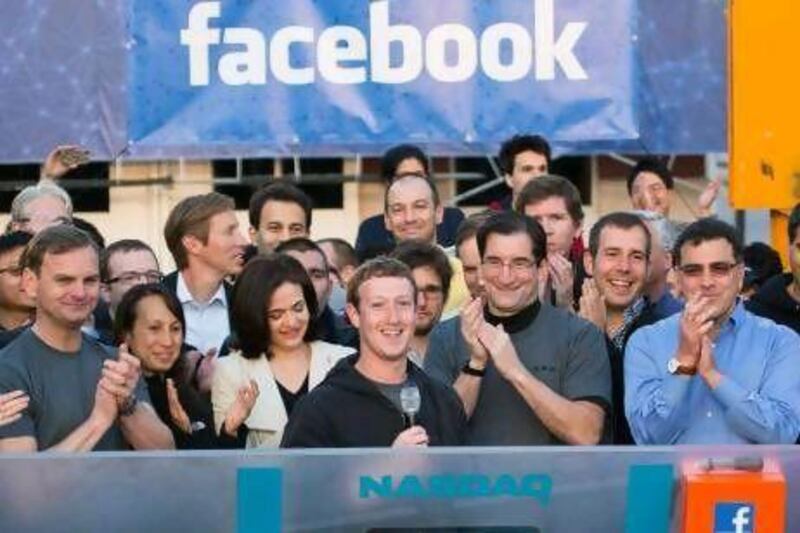 Mark Zuckerberg, centre, rings the Nasdaq opening bell from his Facebook headquarters in Menlo Park, California. 
AP Photo
