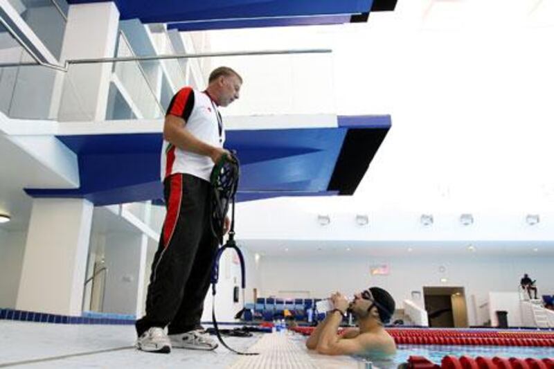 Jay Benner, the UAE coach, passes on instructions to one of his swimmers ahead of tomorrow’s opening leg in Dubai.