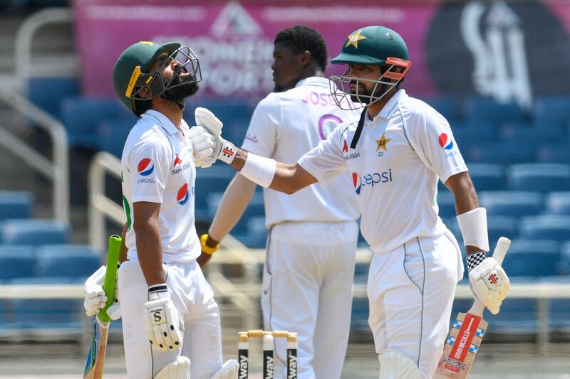 Fawad Alam (L) and Babar Azam (R) of Pakistan 100 partnership during day 1 of the 2nd Test between West Indies and Pakistan at Sabina Park, Kingston, Jamaica, on August 20, 2021.  (Photo by Randy Brooks  /  AFP)