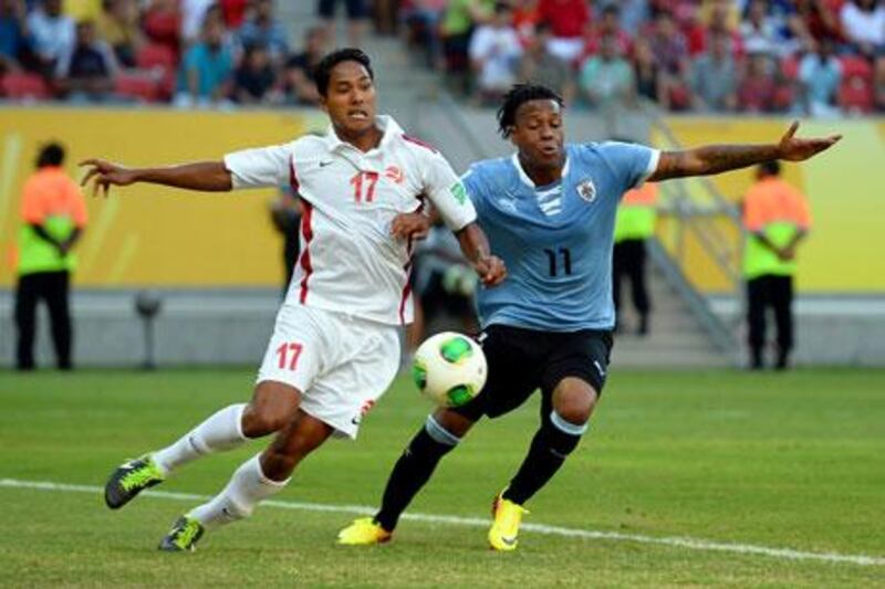 Uruguay's Abel Hernandez, right, scored a hat-trick against Tahiti as both teams were reduced to 10 men. Laurence Griffiths / Getty Images