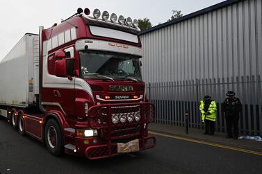 Police officers drive away a lorry in which 39 dead bodies were discovered sparking a murder investigation at Waterglade Industrial Park in Grays, east of London, on October 23, 2019. AFP / Ben STANSALL