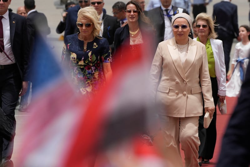 Ms Biden and Egypt's first lady Entisar Amer at the airport. Reuters