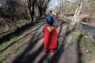 Life inside a red zone:A child dressed in a Superman outfit walks down a street in Casalpusterlengo, one of the towns on lockdown due to a coronavirus outbreak, in this picture taken by schoolteacher Marzio Toniolo in Casalpusterlengo, Italy, February 26, 2020. Picture taken February 26, 2020. Marzio Toniolo/via REUTERS THIS IMAGE HAS BEEN SUPPLIED BY A THIRD PARTY. MANDATORY CREDIT