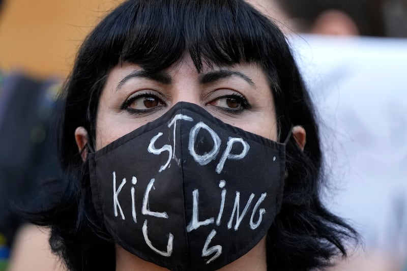 A Lebanese activist takes part in a protest in Beirut, triggered by the death of Amini, 22. AP