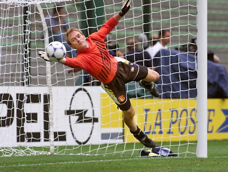 Scottish goalkeeper Jim Leighton dives to deflect a ball during a training session 22 June at Geoffroy Guichard stadium in Saint-Etienne, central France, on the eve of their 1998 Soccer World Cup Group A first round match against Morocco.   (ELECTRONIC IMAGE)   AFP PHOTO / AFP PHOTO / PATRICK KOVARIK