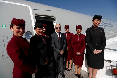FILE PHOTO: Qatar Airways Chief Executive Officer Akbar al-Baker poses with cabin crew in an Airbus A350-1000 at the Eurasia Airshow in the Mediterranean resort city of Antalya, Turkey April 25, 2018. REUTERS/Murad Sezer/File Photo