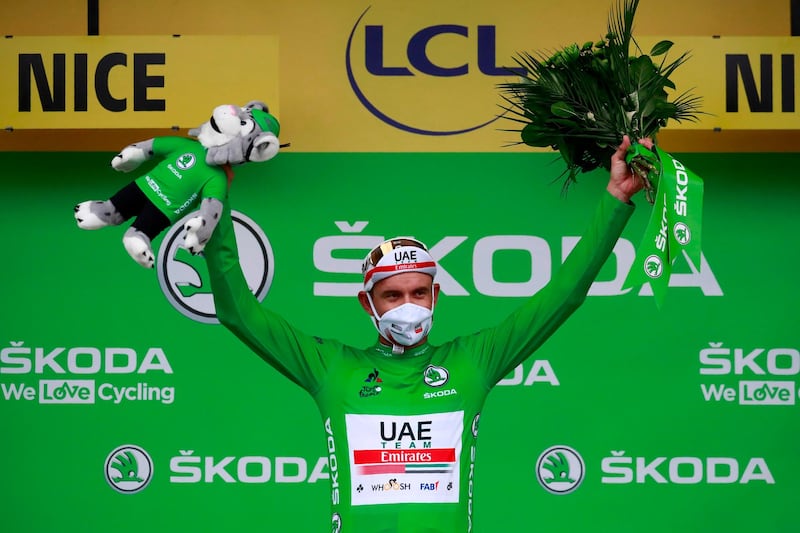 Team UAE Emirates rider Alexander Kristoff celebrates his green jersey for best sprinter. AFP