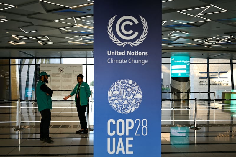 Signs on the Dubai Metro. Cop28 participants are encouraged to use public transport to travel to the venues. AFP