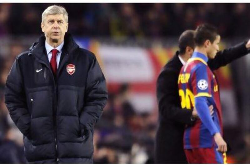 Arsene Wenger, manager of Arsenal,   saw a different match than what the Gunners played on Tuesday against Barcelona. Pierre-Phillippe Marcou / AFP