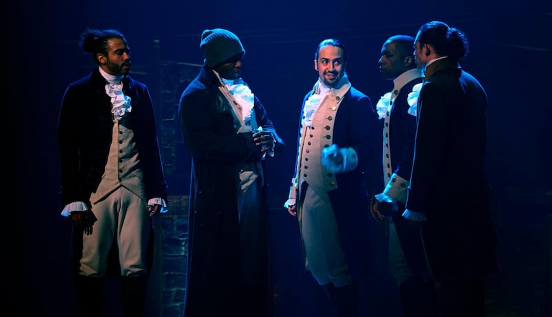 In this image released by Disney Plus, from left, Daveed Diggs, Okieriete Onaodowan, Lin-Manuel Miranda, Leslie Odom Jr. and Anthony Ramos appear in a filmed version of the original Broadway production of "Hamilton." (Disney Plus via AP)
