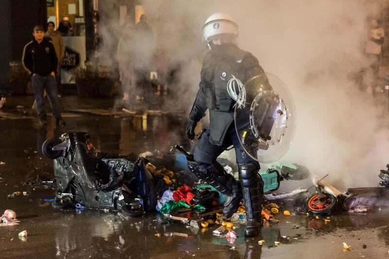 Police detained 12 people after using water cannon and firing tear gas to disperse crowds in the Belgian capital. AP