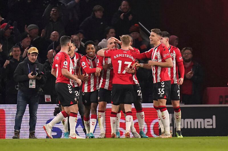 Oriol Romeu, centre, celebrates with Southampton teammates after scoring his team's second goal against Norwich. AP
