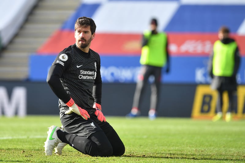 Liverpool's Brazilian goalkeeper Alisson Becker reacts during the English Premier League football match between Leicester City and Liverpool at King Power Stadium in Leicester, central England on February 13, 2021. RESTRICTED TO EDITORIAL USE. No use with unauthorized audio, video, data, fixture lists, club/league logos or 'live' services. Online in-match use limited to 120 images. An additional 40 images may be used in extra time. No video emulation. Social media in-match use limited to 120 images. An additional 40 images may be used in extra time. No use in betting publications, games or single club/league/player publications.
 / AFP / POOL / Paul ELLIS / RESTRICTED TO EDITORIAL USE. No use with unauthorized audio, video, data, fixture lists, club/league logos or 'live' services. Online in-match use limited to 120 images. An additional 40 images may be used in extra time. No video emulation. Social media in-match use limited to 120 images. An additional 40 images may be used in extra time. No use in betting publications, games or single club/league/player publications.
