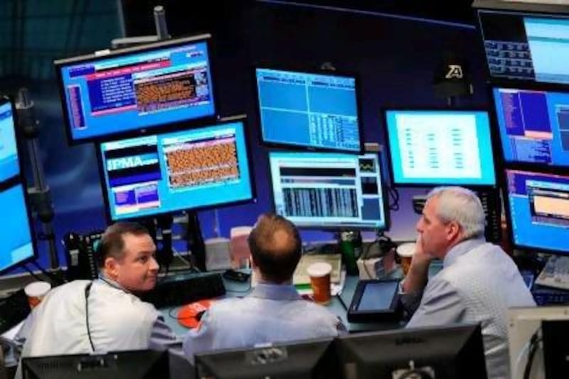 Stock specialists watch prices at their post on the floor just before the opening bell May 10, 2010 at the New York Stock Exchange. US stocks rebounded strongly Monday, with the blue-chip Dow index up more than 300 points or three percent at the open, after a massive rescue package for the eurozone eased fears of a sovereign debt crisis.
 AFP PHOTO/Stan Honda