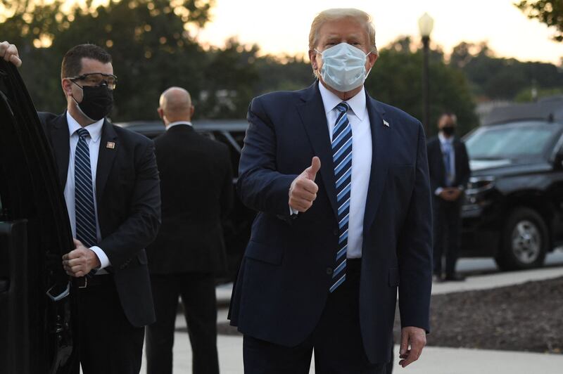 Former US president Donald Trump gives the thumbs-up after leaving the Walter Reed Medical Centre in Bethesda, Maryland, where he was treated for Covid-19 in October 2020. AFP