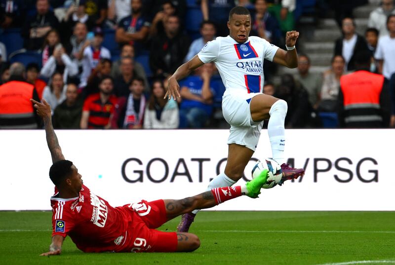 Brest's Belgian defender Noah Fadiga battles for the ball with Kylian Mbappe. AFP