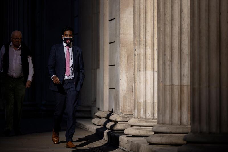 Pedestrians walk through the City of London on Monday morning. Getty Images