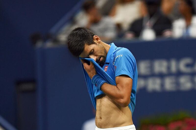 Novak Djokovic of Serbia reacts to losing a point against Stan Wawrinka of Switzerland. Jewel Samad / AFP