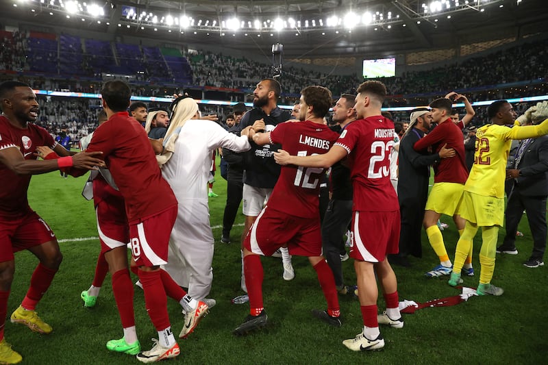 An altercation takes place as players of Qatar celebrate victory over Iran. Getty Images