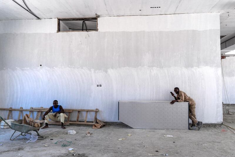 Abu Dhabi, United Arab Emirates, June 15, 2019.  
The UAE's mandatory midday break for people working outdoors during the summer months will come into force on Saturday. --  Construction workers take it easy during midday break.
Victor Besa/The National
Section:  NA
Reporter: