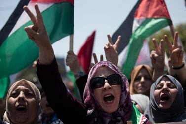 Palestinian women chant slogans and flash the victory sign as they demonstrate against Israeli plans for the annexation of parts of the West Bank, in Gaza City, Wednesday, July 1, 2020. AP Photo