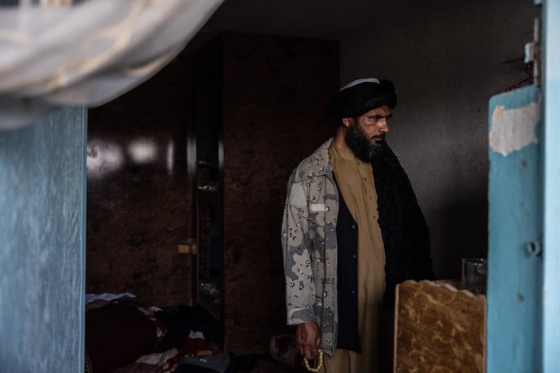 A Taliban fighter inspects an empty room at Pul-e-Charkhi prison. Stefanie Glinski for The National