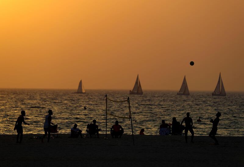 Visitors to Kite beach play Footvolley at sunset in Dubai on June 8th, 2021. Chris Whiteoak / The National. 
Reporter: N/A for News
