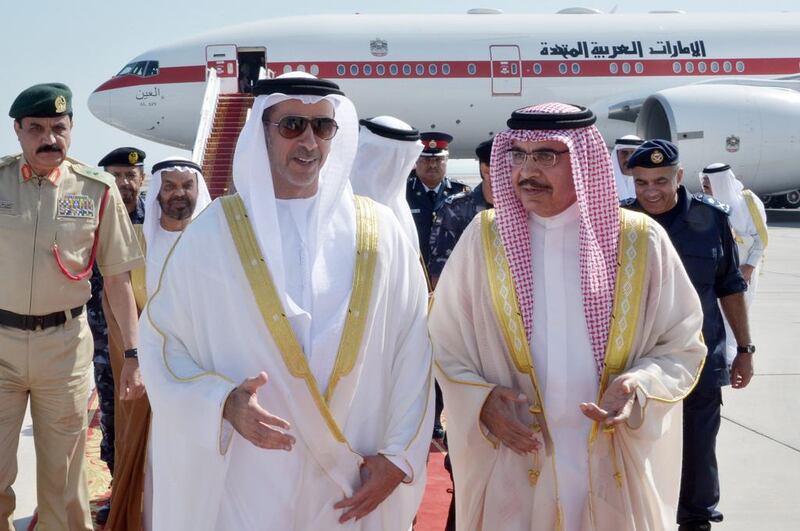 Sheikh Saif bin Zayed, Deputy Prime Minister and Minister of the Interior, is welcomed by Sheikh Rashid bin Abdulla Al Khalifa, Bahraini Interior Minister, upon landing in Bahrain. Wam