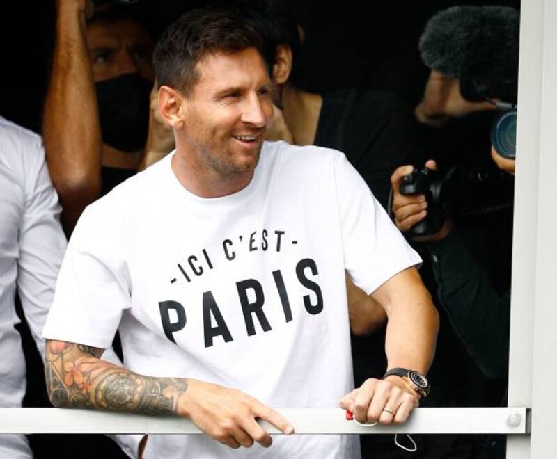 Lionel Messi greets supporters after landing at Le Bourget Airport in Paris, on August 10, for a medical before joining the Paris Saint-Germain club.