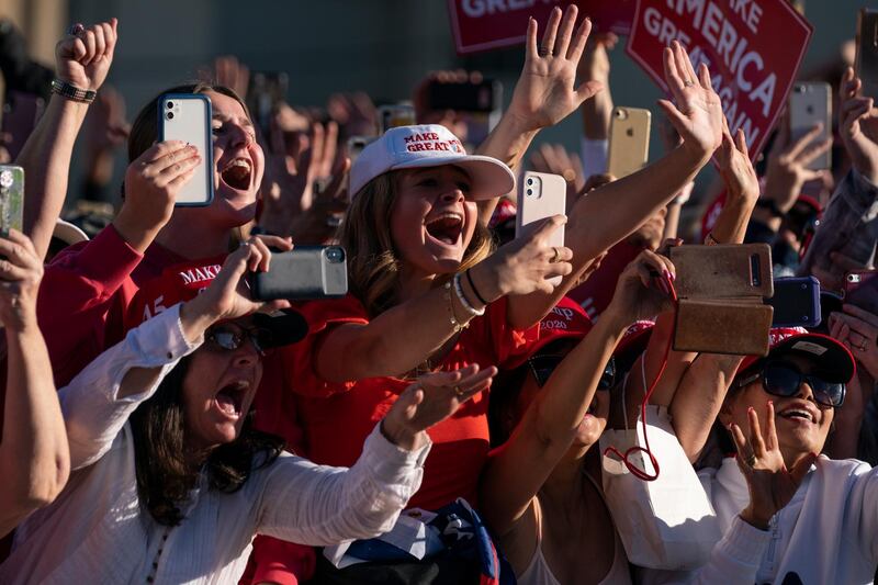 Supporters of President Donald Trump cheer as he walks off stage after speaking during a campaign rally at Phoenix Goodyear Airport, in Goodyear, Arizona. AP Photo