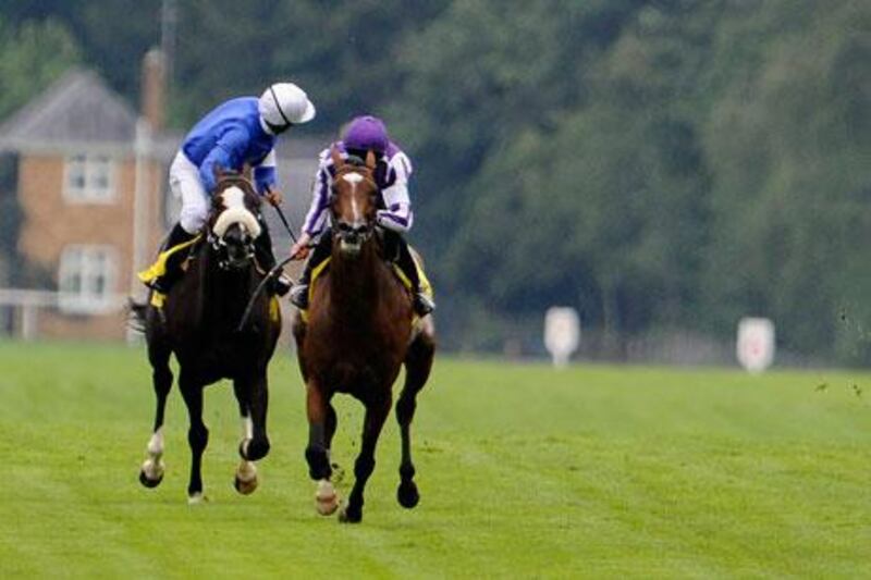 Ahmed Ajtebi, onboard Debussy, left, looks round for stable companion Rewilding and Frankie Dettori, who had fallen from his mount during the King George VI and Queen Elizabeth Stakes at Ascot yesterday. Rewilding suffered a serious injury and had to be put down.