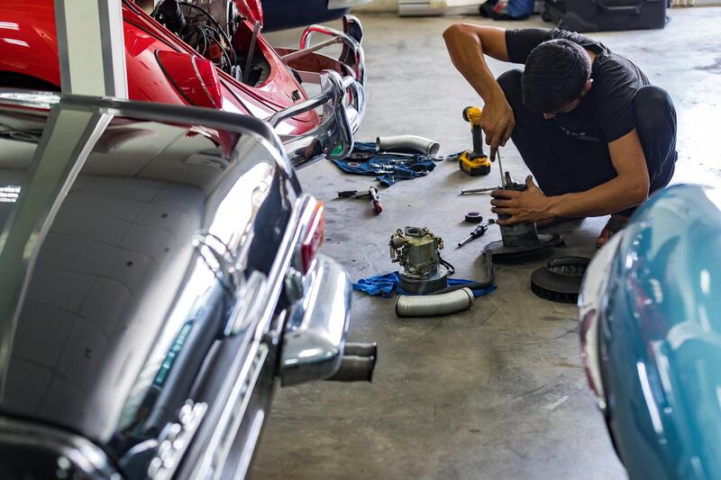 Dubai, United Arab Emirates - June 11th, 2018: Photo project. Nawaz Ali fixes and restores a 1965 VW Beatle Cabriolet at Jeepers Auto Mechanical / Classic Cars Dubai. Monday, June 9th, 2018 Al Quoz, Dubai. Chris Whiteoak / The National