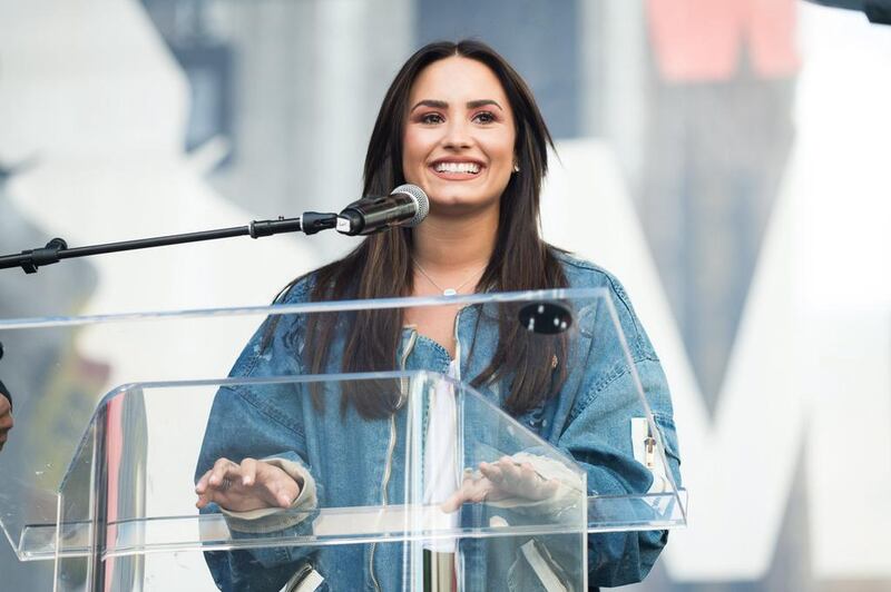 Musician Demi Lovato speaks onstage at the women’s march in Los Angeles, California. Emma McIntyre / Getty Images / AFP