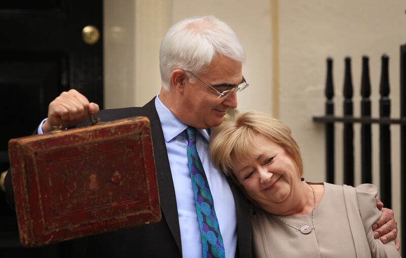 Mr Darling hugs his wife Maggie outside number 11 Downing Street in 2010, before he presented the government's last budget before the general election
