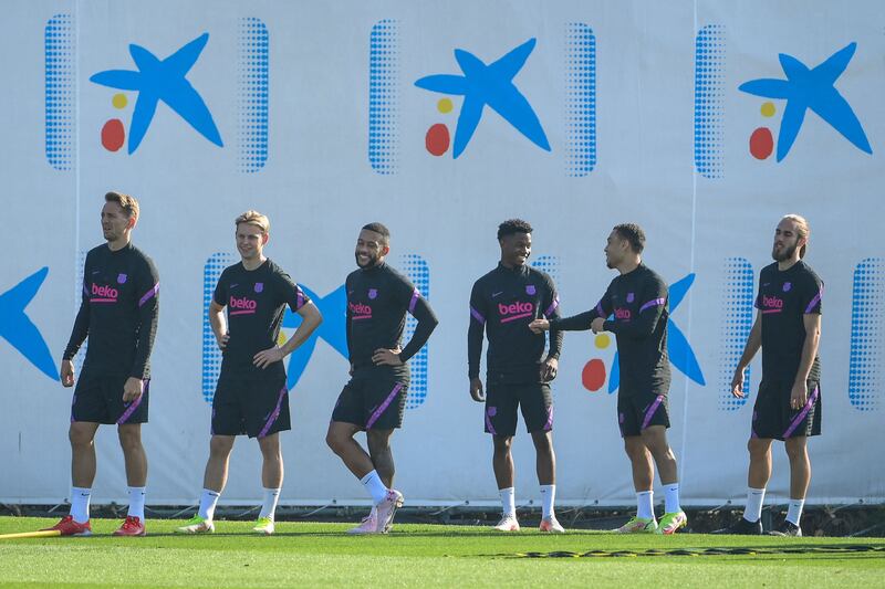 From left: Barcelona's forward Luuk de Jong, midfielder Frenkie De Jong, forward Memphis Depay, midfielder Ansu Fati, defender Sergino Dest and defender Oscar Mingueza take part in a training session. AFP