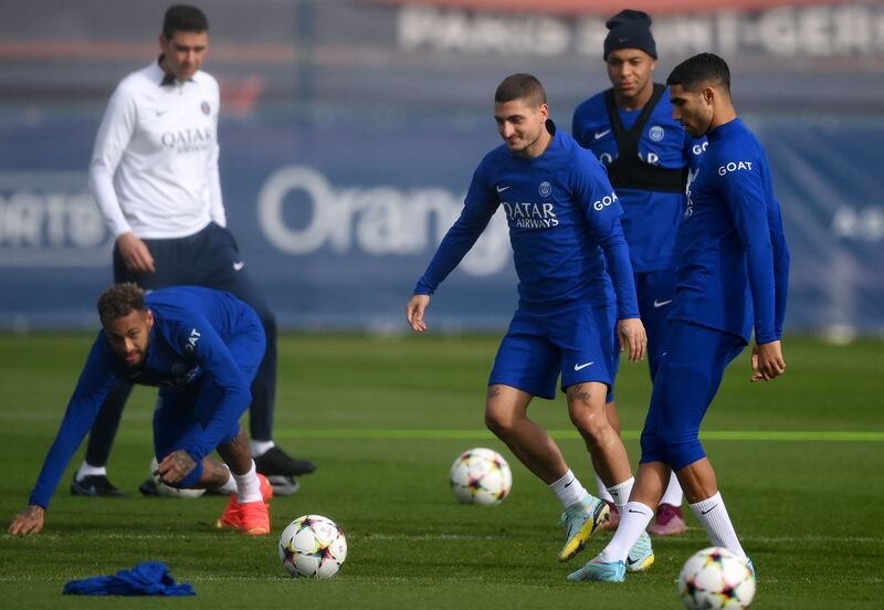 Neymar, left, looks on as midfielder Marco Verratti, second left, and defender Achraf Hakimi train for the Champions League first round match against Benfica. AFP