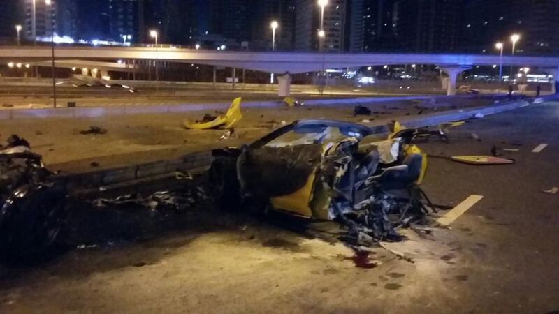 Three men were killed in the early hours of Sunday after their Ferrari hit a pavement and flew into a lamp post. Courtesy Dubai Police