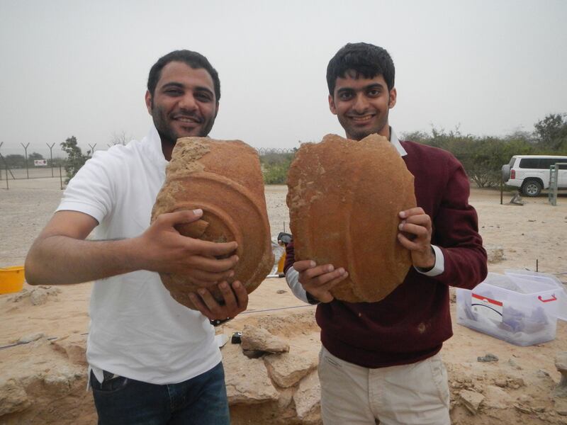 Ali Al Meqbali and Abdulla Al Kaabi with Dilmun storage jar fragments unearthed from Sir Bani Yas. Courtesy TCA Abu Dhabi