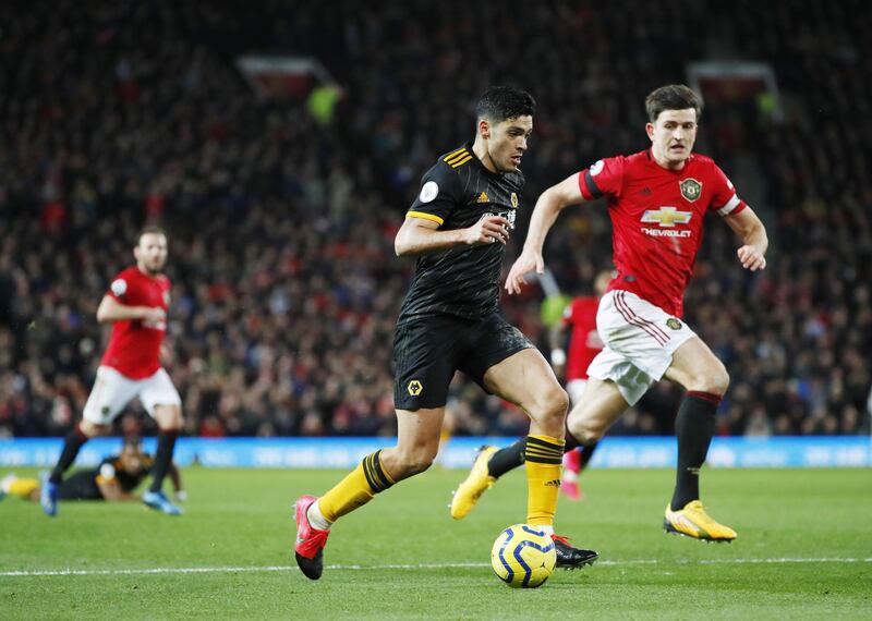 Wolves' Raul Jimenez (L) in action against Manchester United Harry Maguire. EPA