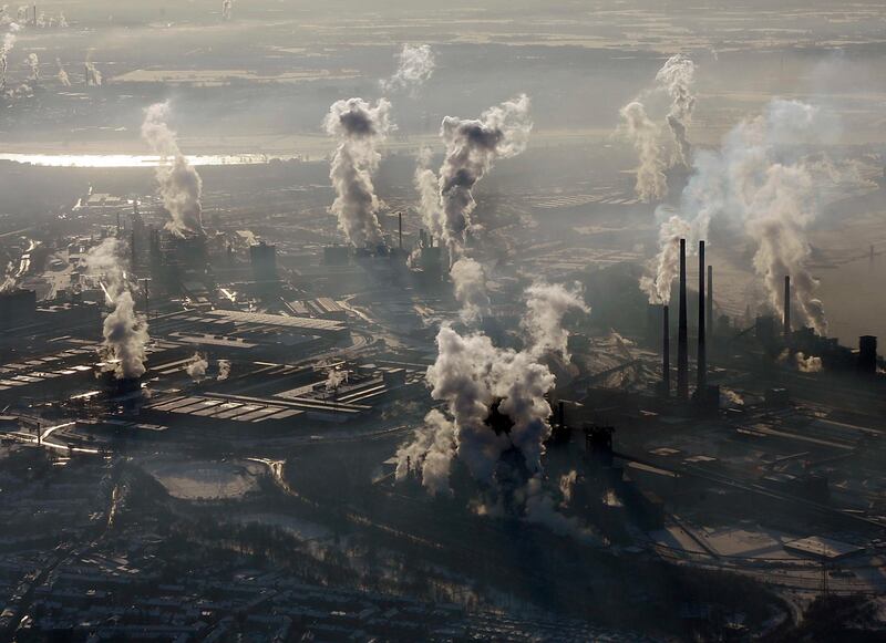 FILE - In this Jan. 9, 2009 file photo smoke rises from the steel company ThyssenKrupp in Duisburg , western Germany. Levels of carbon dioxide in the atmosphere have steadily increased since the days of the industrial revolution, contributing to the greenhouse effect that is spurring global warming.  (AP Photo/Frank Augstein, file)