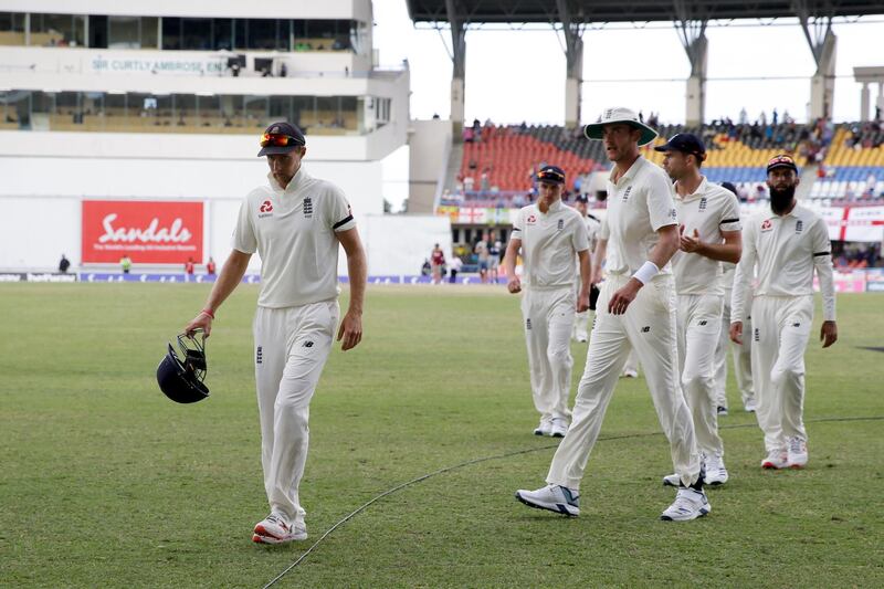 England's captain Joe Root leads his team off the field after losing by ten wickets against West Indies during day three of the second Test cricket match at the Sir Vivian Richards Stadium in North Sound, Antigua and Barbuda, Saturday, Feb. 2, 2019. (AP Photo/Ricardo Mazalan)