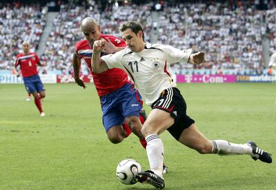 MUNICH, GERMANY - JUNE 09:  Miroslav Klose of Germany is challenged by Douglas Sequeira of Costa Rica during the FIFA World Cup Germany 2006 Group A match between Germany and Costa Rica at the Stadium Munich on June 9, 2006 in Munich, Germany.  (Photo by Ben Radford/Getty Images)