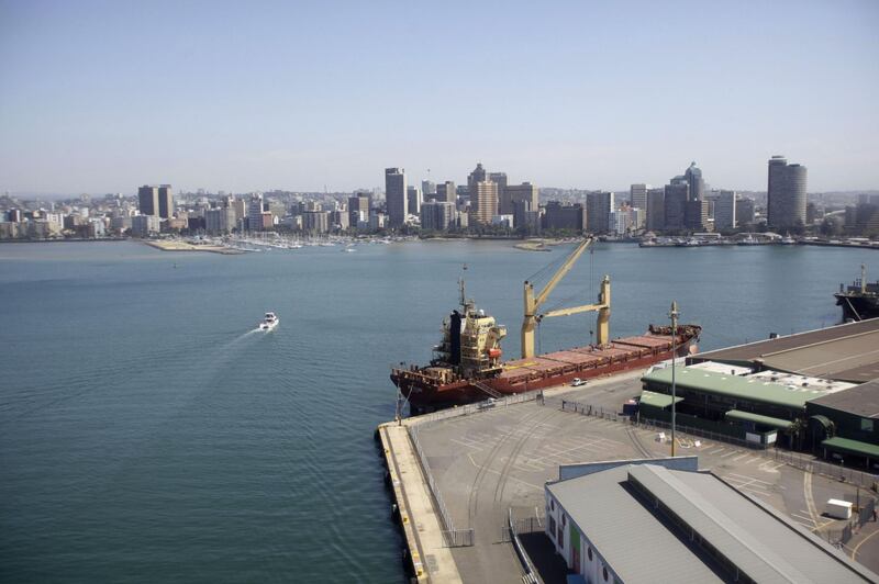 Commercial and residential properties sit on the city skyline beyond the Port of Durban, operated by Transnet SOC Holdings Ltd.'s Ports Authority, in Durban, South Africa, on Tuesday, Oct. 20, 2015. Transnet is planning to spend between 340 billion rand and 380 billion rand over the next ten years to expand and upgrade rail and port capacity, Acting Chief Executive Officer Siyabonga Gama said.  Photographer: Kevin Sutherland/Bloomberg