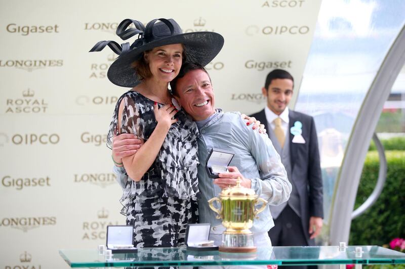Darcey Bussell, left, presents jockey Frankie Dettori with the trophy for winning the Queen Mary Stakes with Raffle Prize. Press Association
