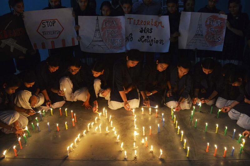 Schoolgirls light candles during a vigil at a school in Amritsar, India, on November 16, 2015, for victims of the terror attacks in the French capital of ParisNarinder Nanu / Agence France-Presse