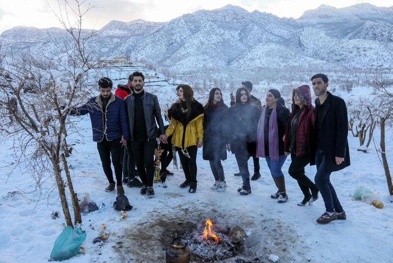 Iraqi Kurds perform a traditional dance near Safin Mountain, close to the city of Irbil, the capital of Iraq's northern Kurdish autonomous region. AFP